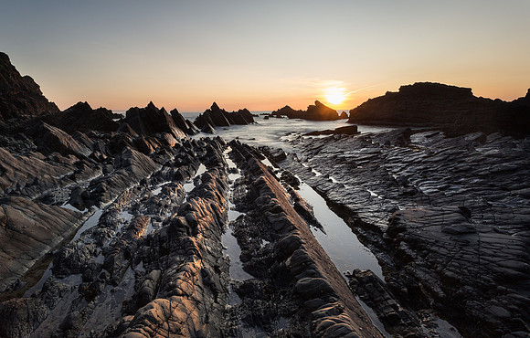Late sun falling on the rocks at Hartland quay.